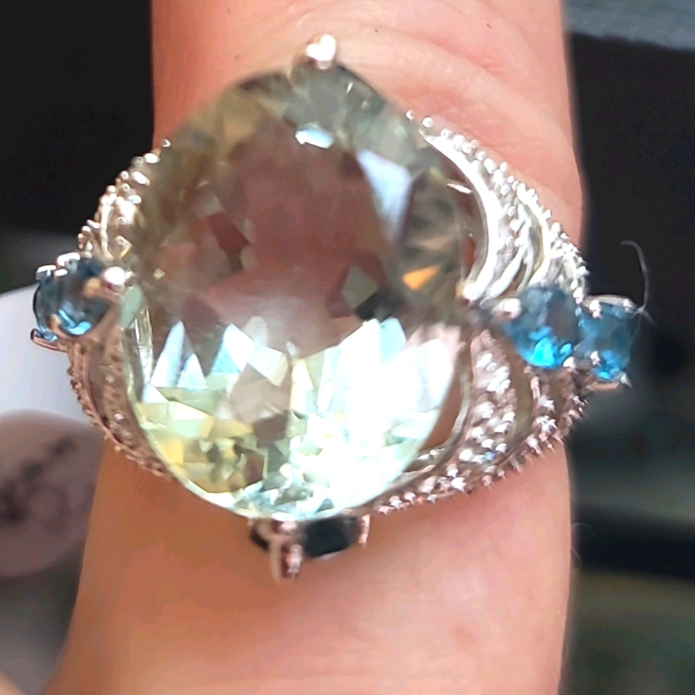 Aquamarine diamond ring with small topaz.